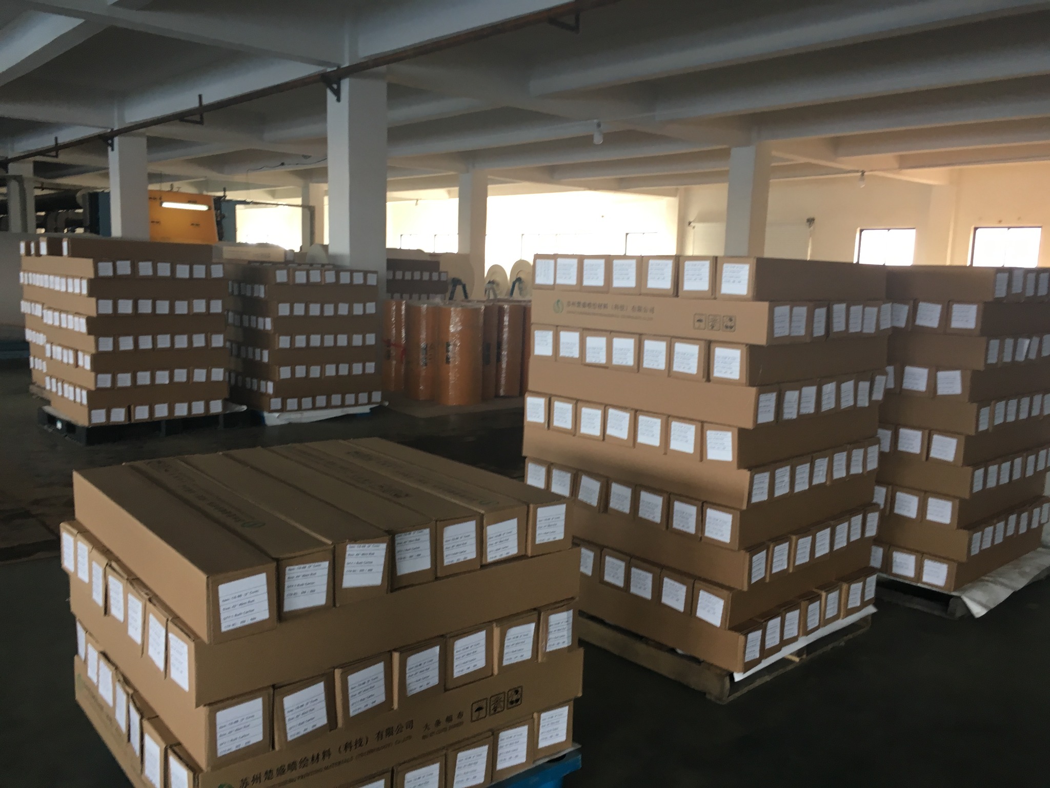 Bulk printable canvas rolls packed in cartons and prepared for shipment at Colors Art factory