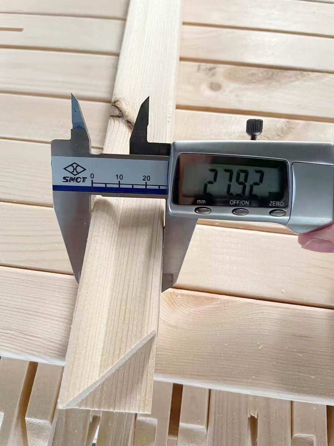 Pine stretcher bar profile dimensions checked with a digital caliper